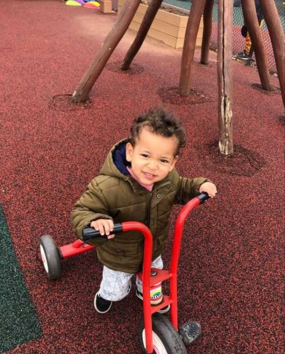 Toddler with a bike.