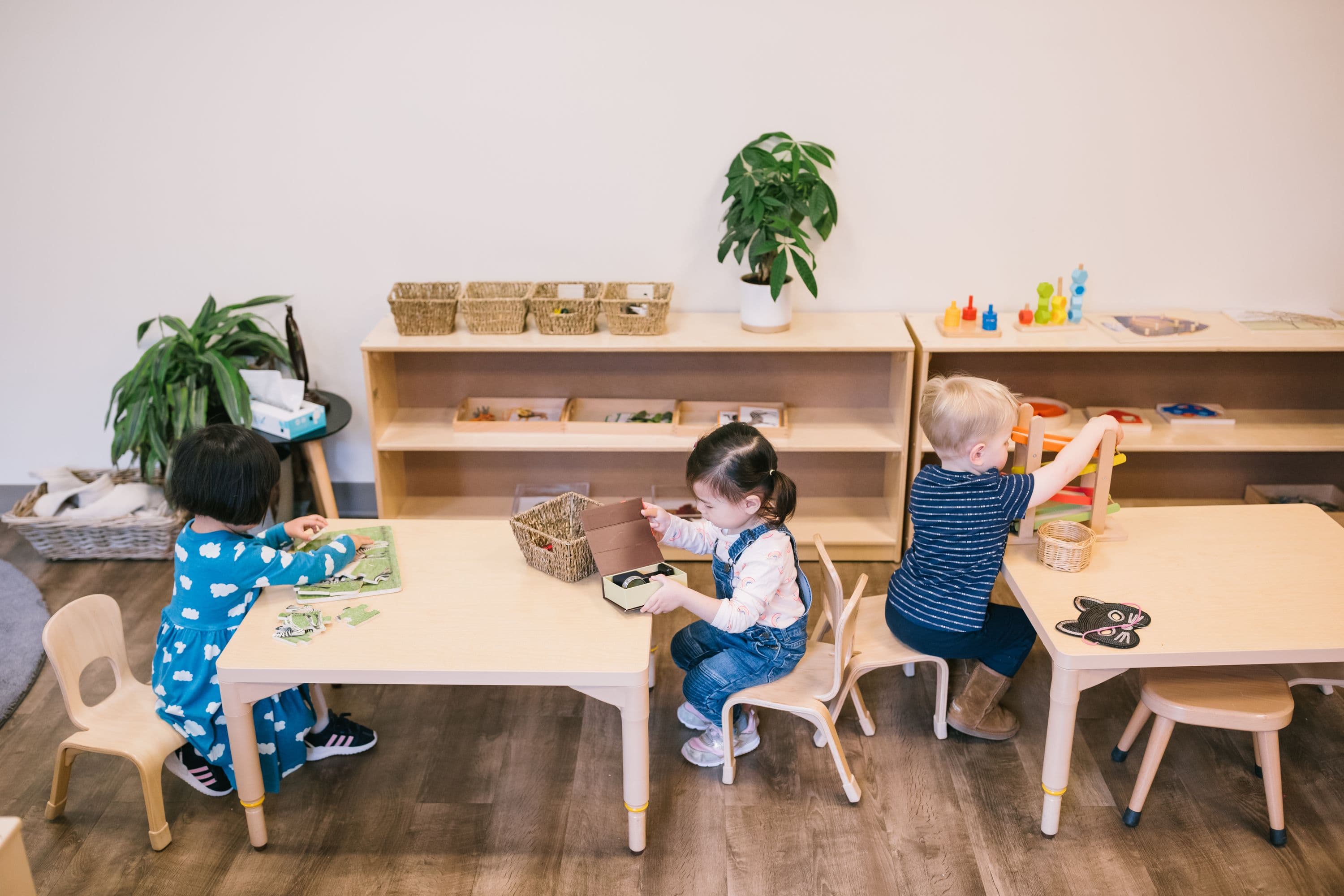 guidepost montessori students sitting at tables